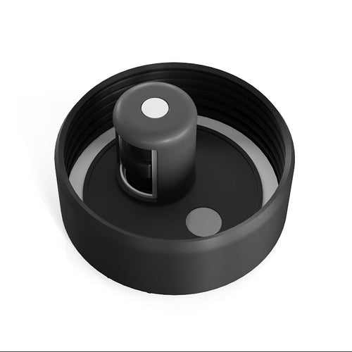 A black plastic replacement cap or lid component with a threaded outer ring, a central cylindrical protrusion, and small circular details, shown on a plain white background.