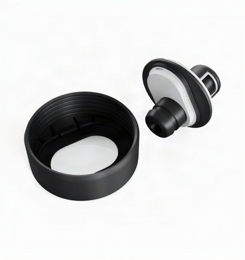 A black plastic replacement lid and inner seal component for a bottle or tumbler, shown disassembled on a clean white background.
