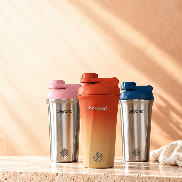 Beyond Twist insulated stainless steel protein shakers in pink, terracotta and blue