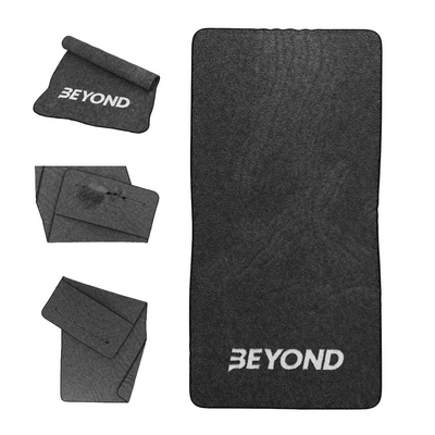 Beyond Black microfibre gym towel shown folded and laid flat